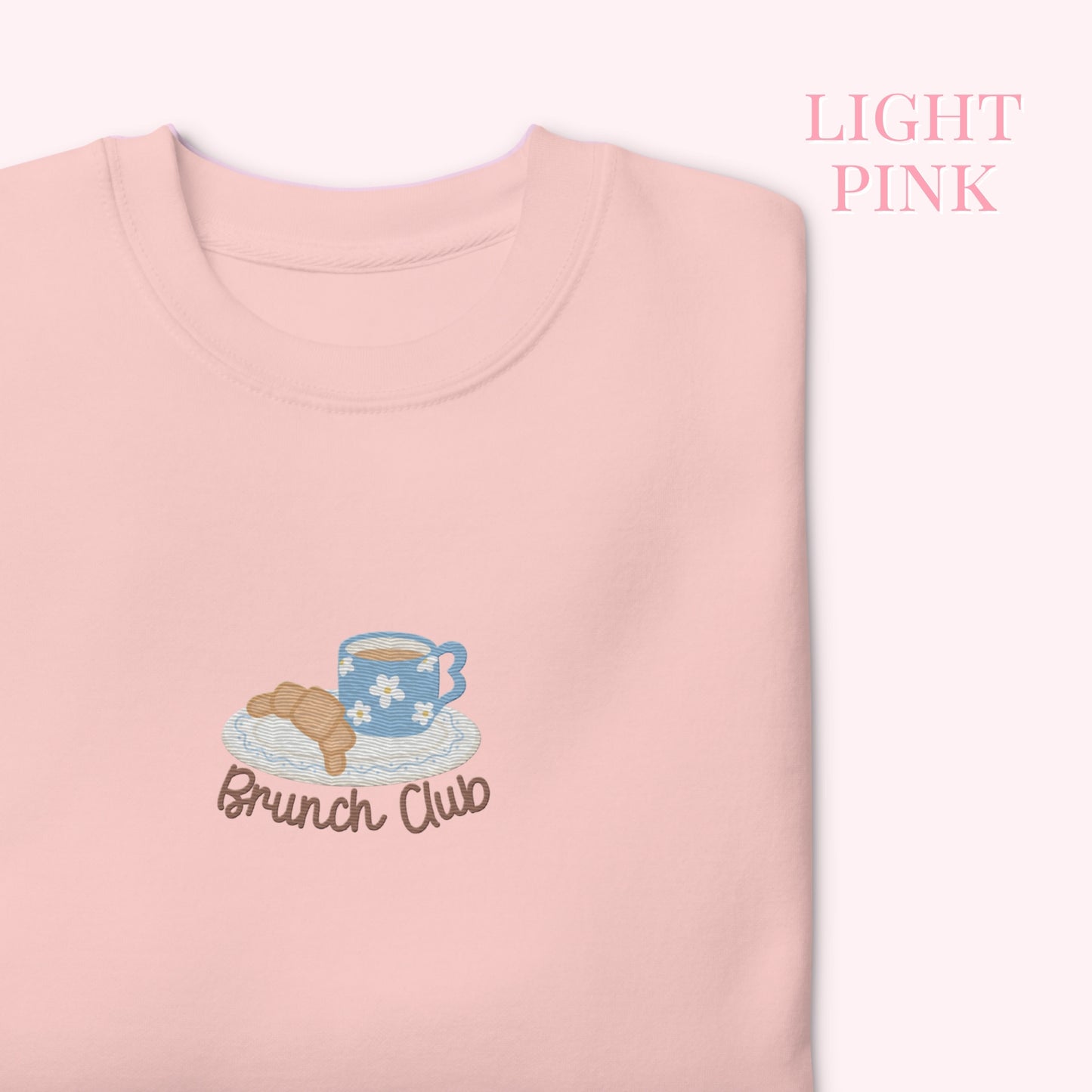 Light pink sweatshirt with 'Brunch Club' embroidery croissant and coffee. cozy girl slow life aesthetic