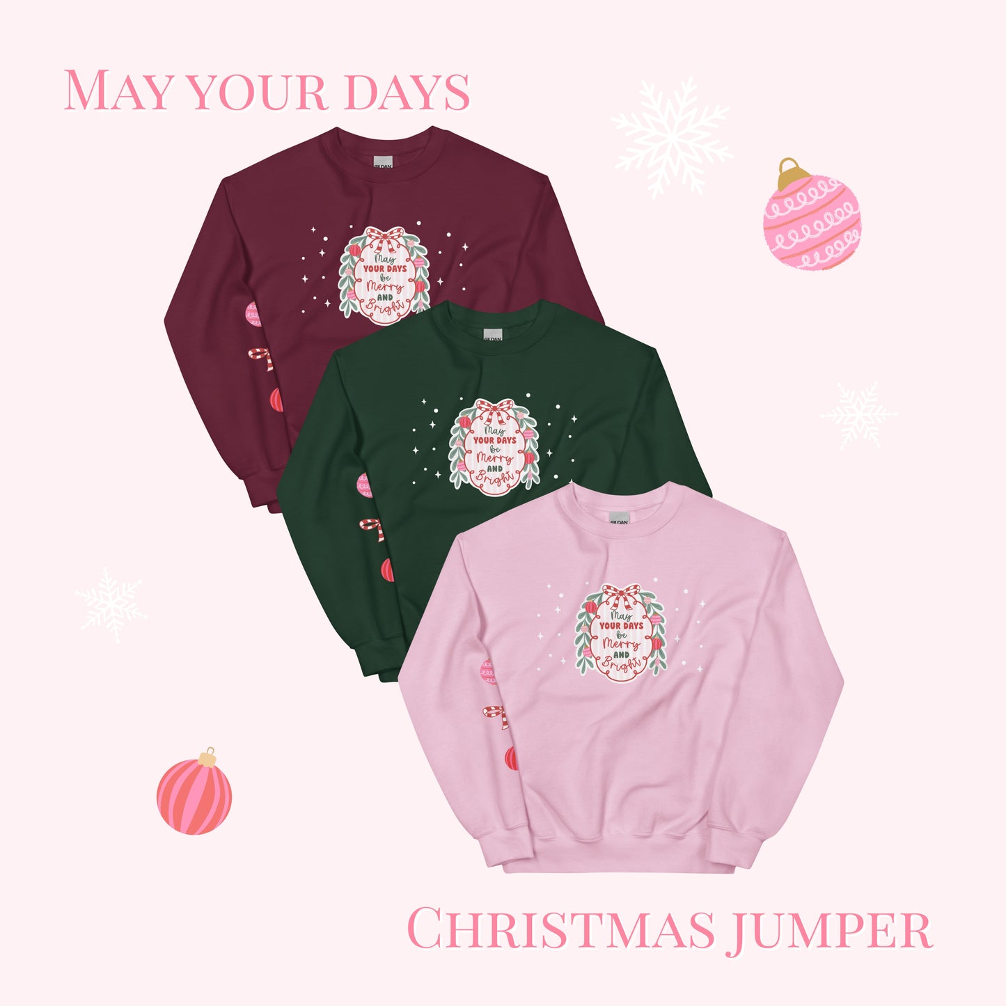 Three Christmas jumpers in maroon, green, and pink with festive designs on a white background.
