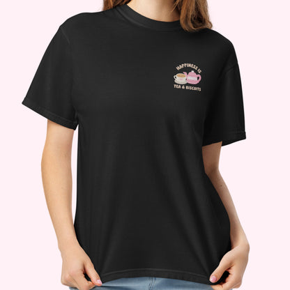 Close-up of "Happiness is Tea and Biscuits" script with a tiny embroidered teacup and teapot on a black-coloured t-shirt.