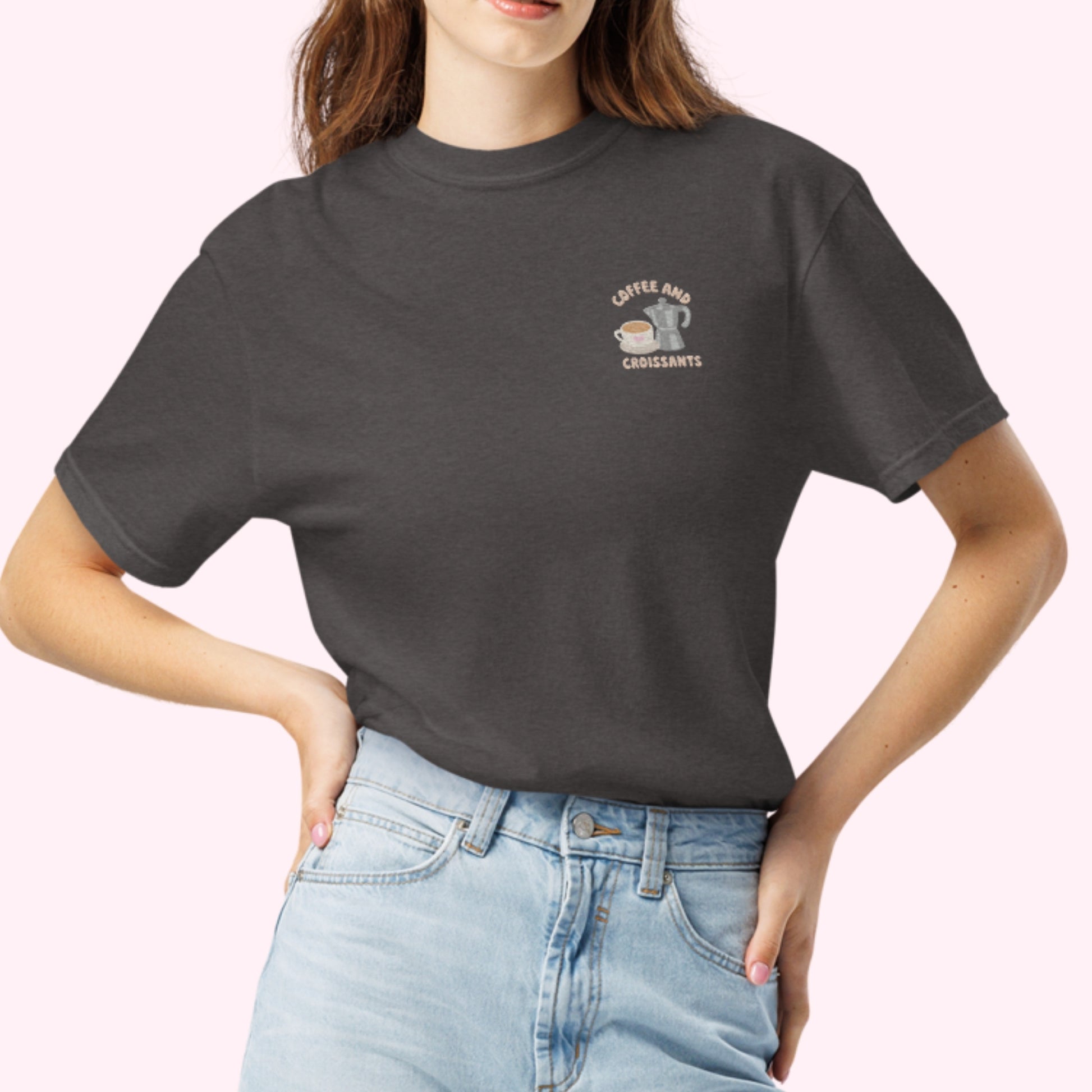 Embroidered black tshirt with coffee and croissant text and a cute coffee mug and grey stove top coffee maker. slow cozy moments. coffee lover gift