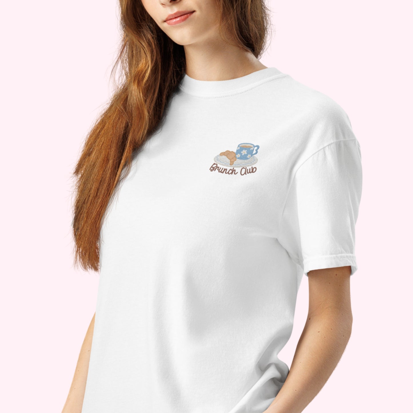 Women wearing a white t-shirt with 'Brunch Club' embroidered design, featuring a coffee cup and croissant illustration. Cafe slow life cozy girl