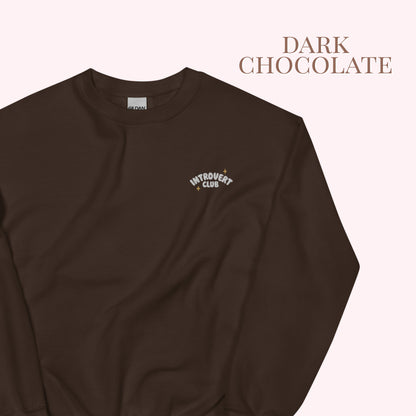 Dark chocolate sweatshirt with 'Introvert Club' logo on a white background