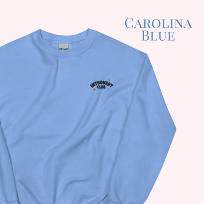 Light blue sweatshirt with 'Introvert Club' text on a white background
