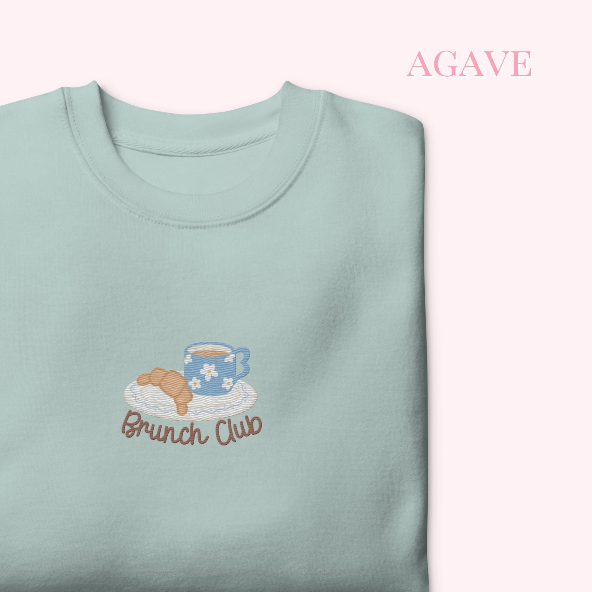 Light blue sweatshirt with 'Brunch Club' embroidery on a white background, cozy girl slow life aesthetic