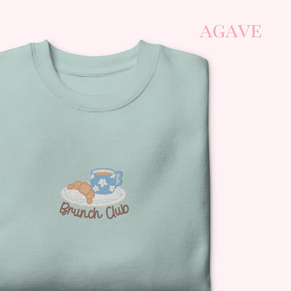 Light blue sweatshirt with 'Brunch Club' embroidery on a white background, cozy girl slow life aesthetic