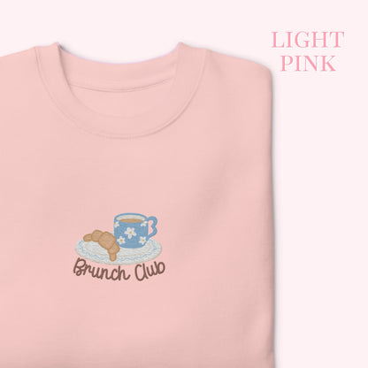 Light pink sweatshirt with 'Brunch Club' embroidery croissant and coffee. cozy girl slow life aesthetic