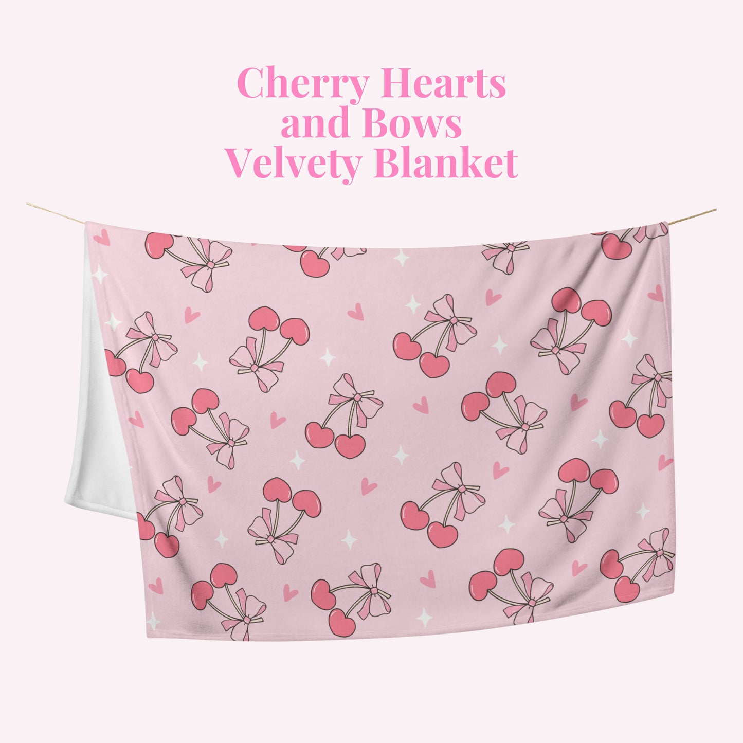 Pink velvety blanket with cherry hearts and bows pattern on a pink background