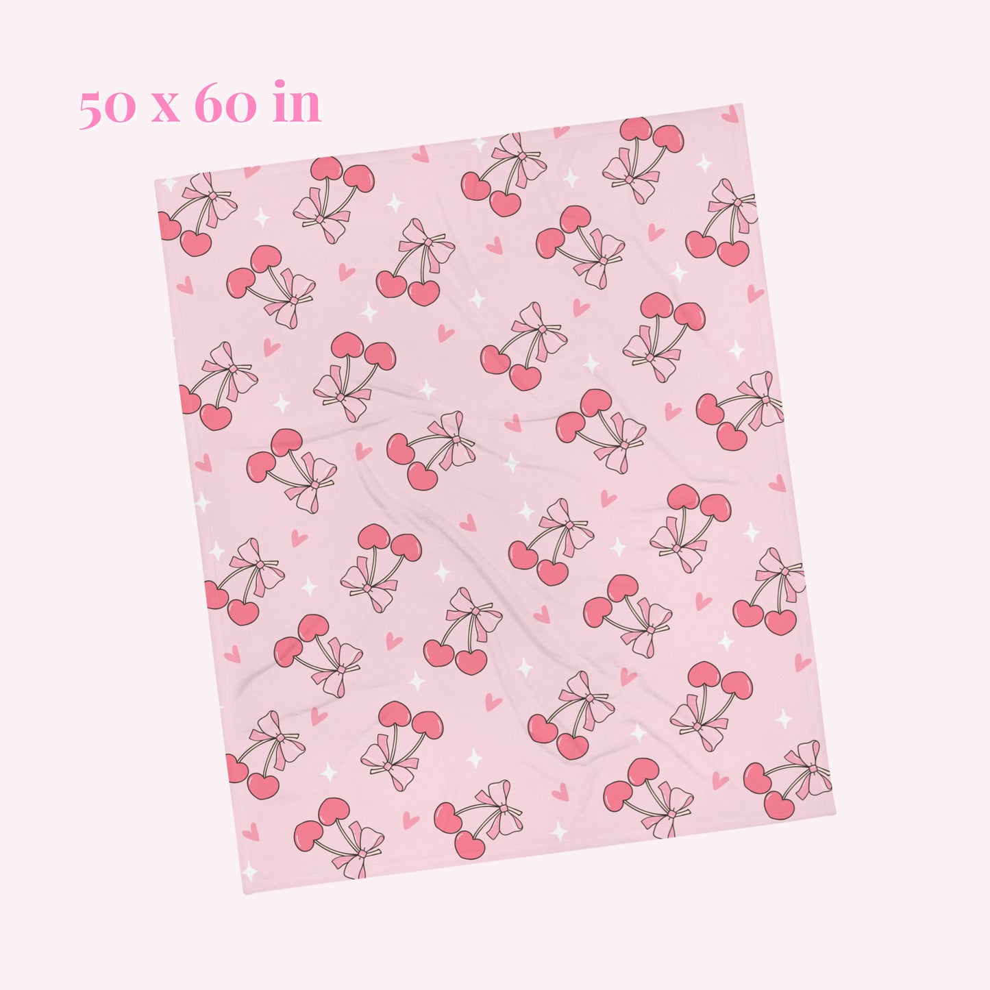 Pink blanket with cherry bow pattern. Blanket size 50 x 60 inches 