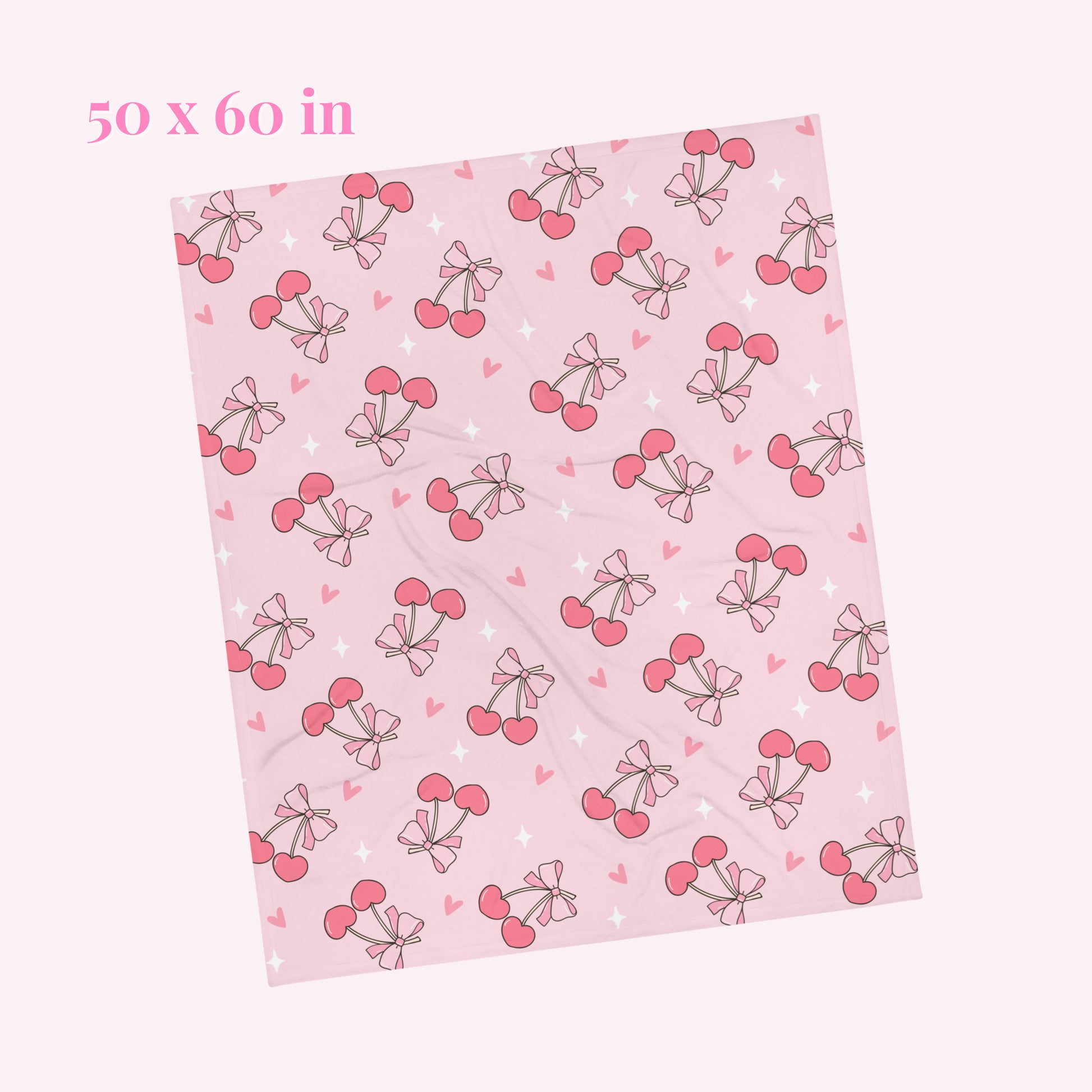 Pink blanket with cherry bow pattern. Blanket size 50 x 60 inches 