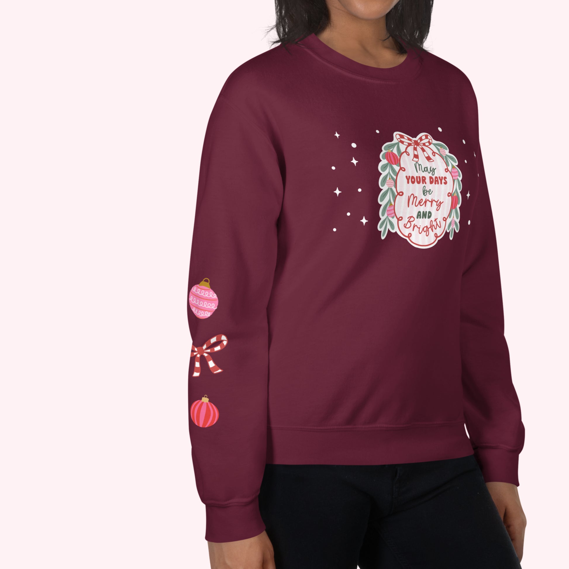 Maroon sweatshirt with Christmas-themed design on a white background