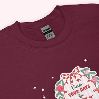 Maroon sweatshirt with a christmas graphic and 'Gildan' label on a white background