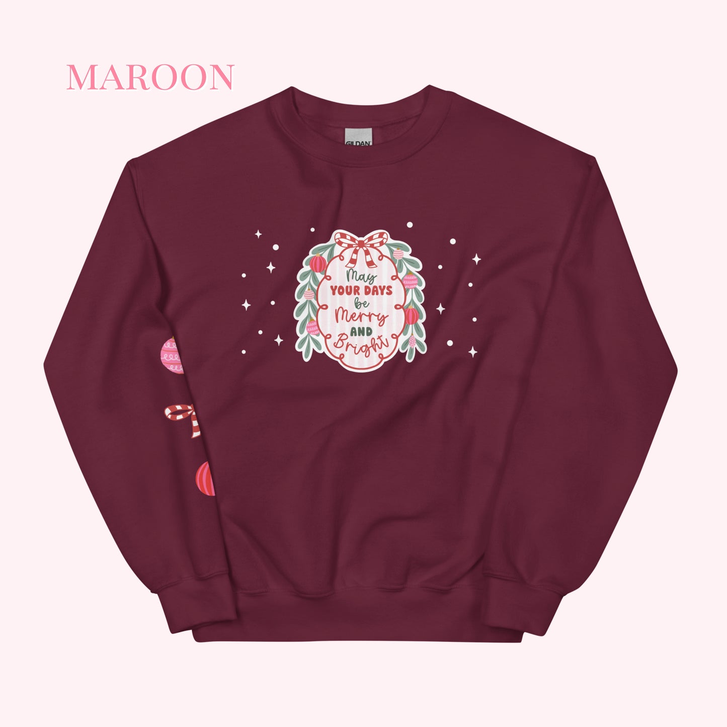 Maroon sweatshirt with festive design on a white background