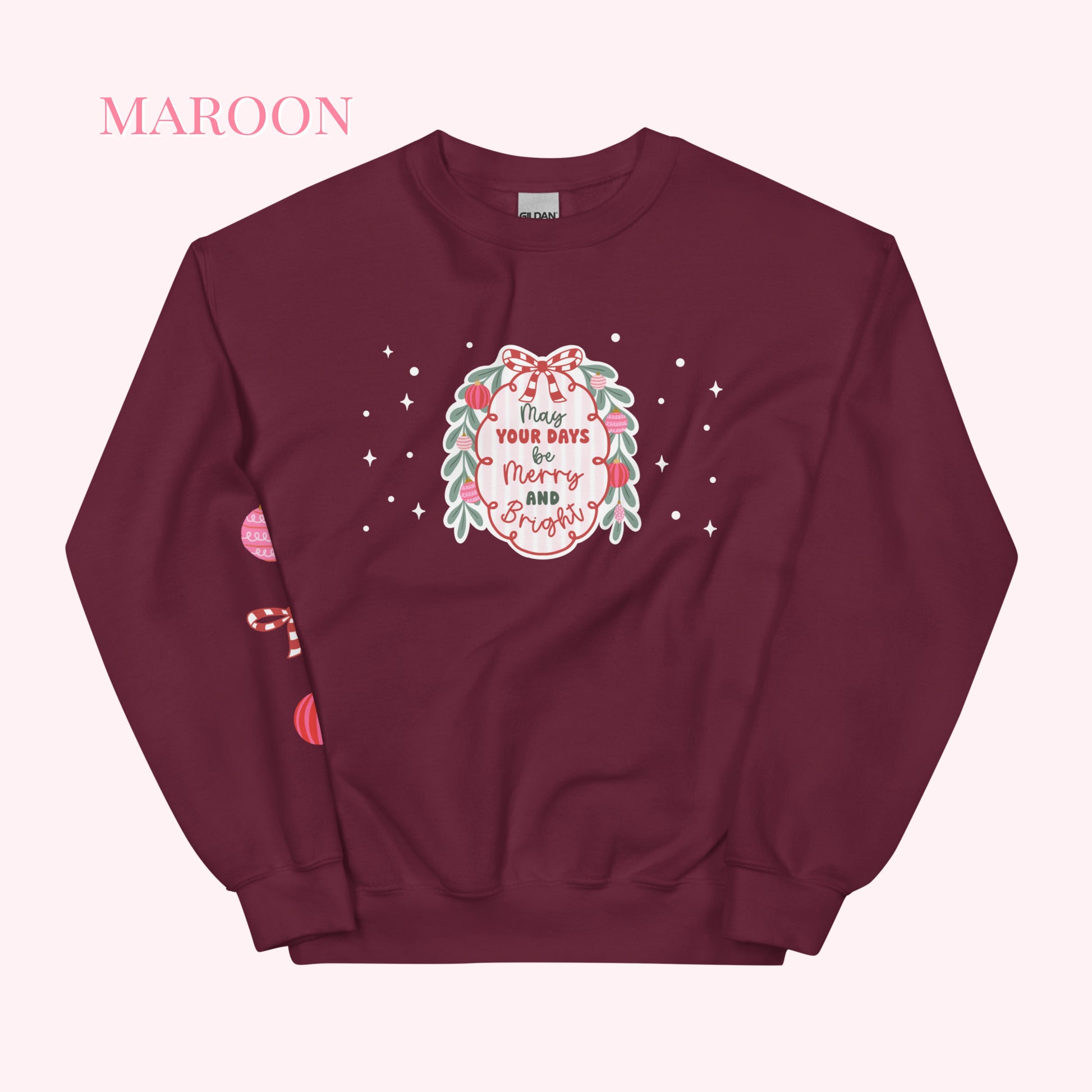 Maroon sweatshirt with festive design on a white background