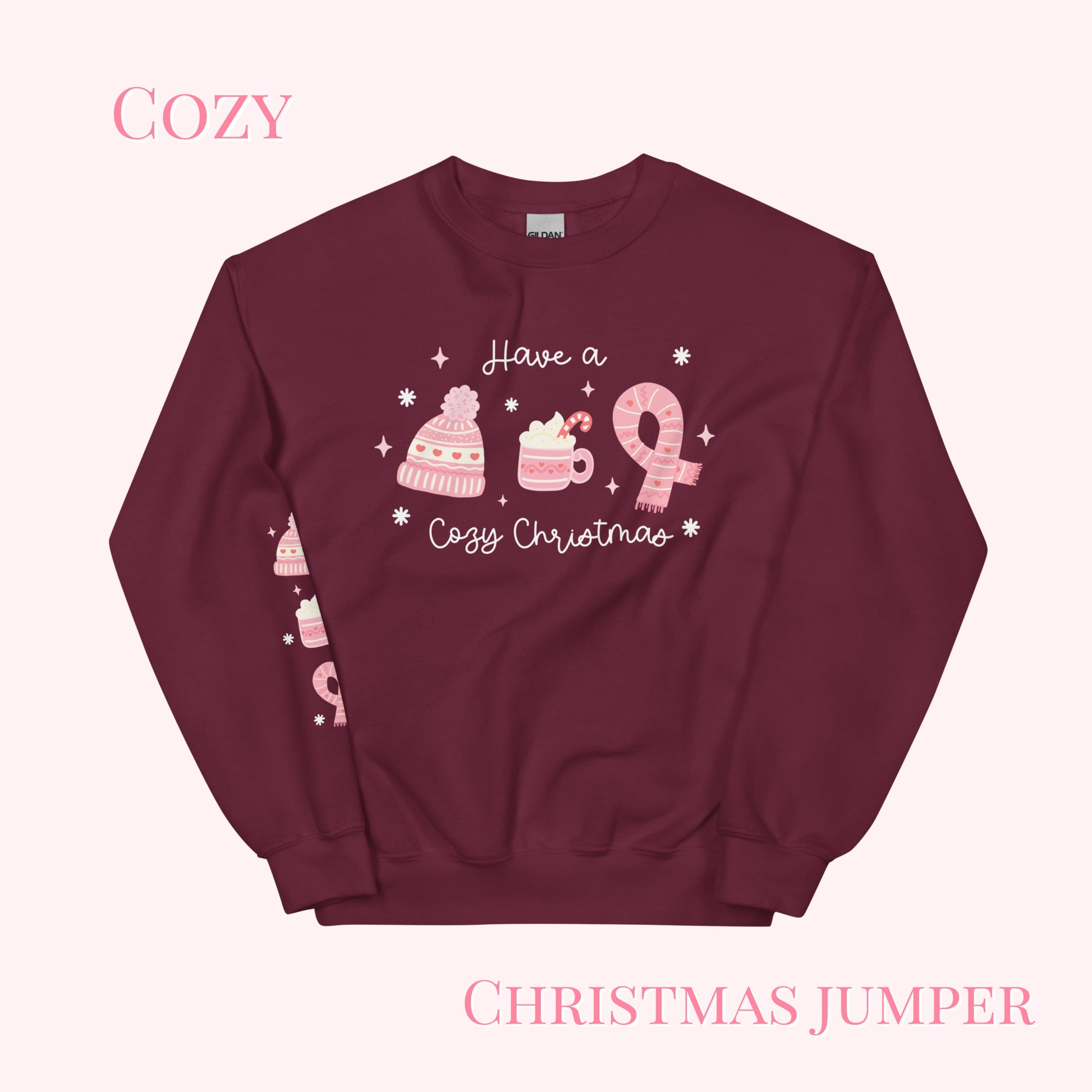 Maroon Christmas sweater with pink graphics and text on a white background